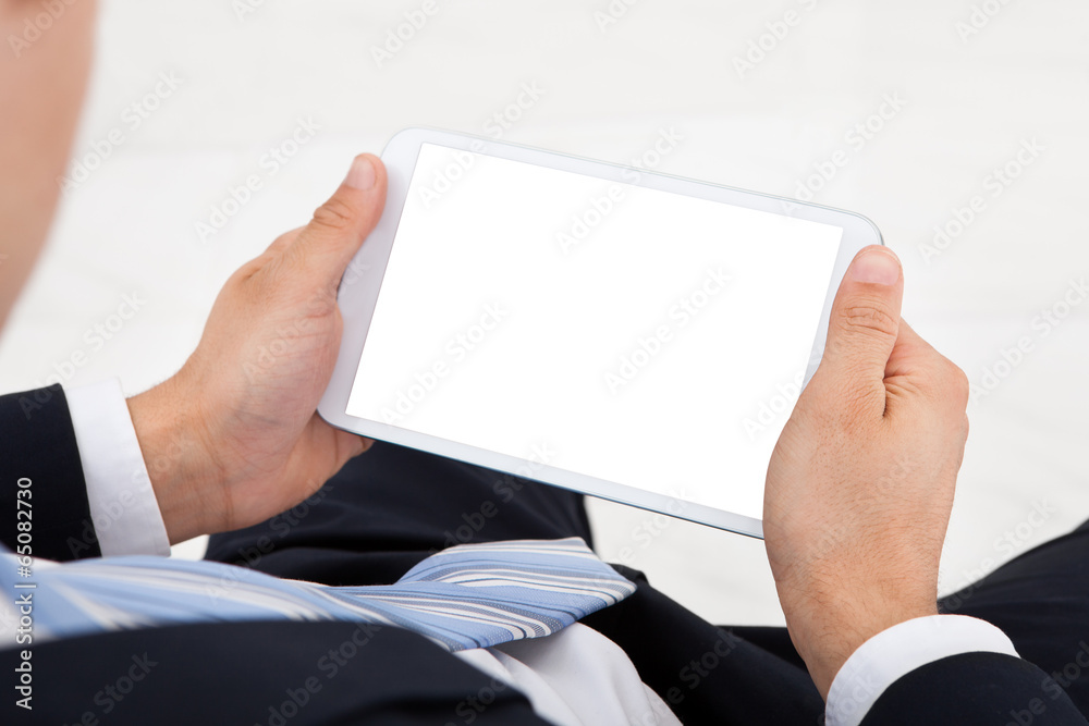 Businessman Using Digital Tablet In Office Businessman Using Digital Tablet In Office
