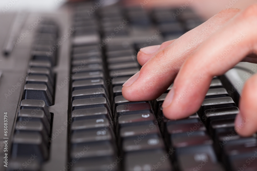 Man Using Computer Keyboard Man Using Computer Keyboard