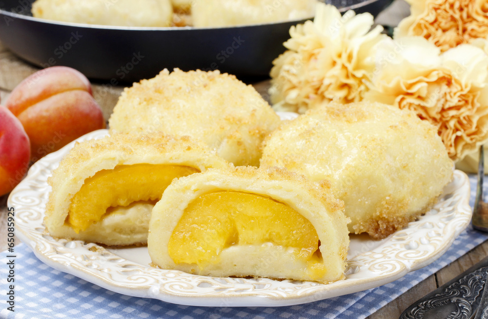Peach in pastry, popular austrian dish. Garden party table Peach in pastry, popular austrian dish. Garden party table