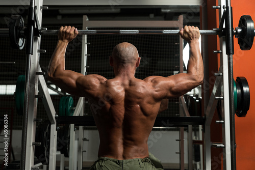 Healthy Mature Man Doing Exercise For Shoulder