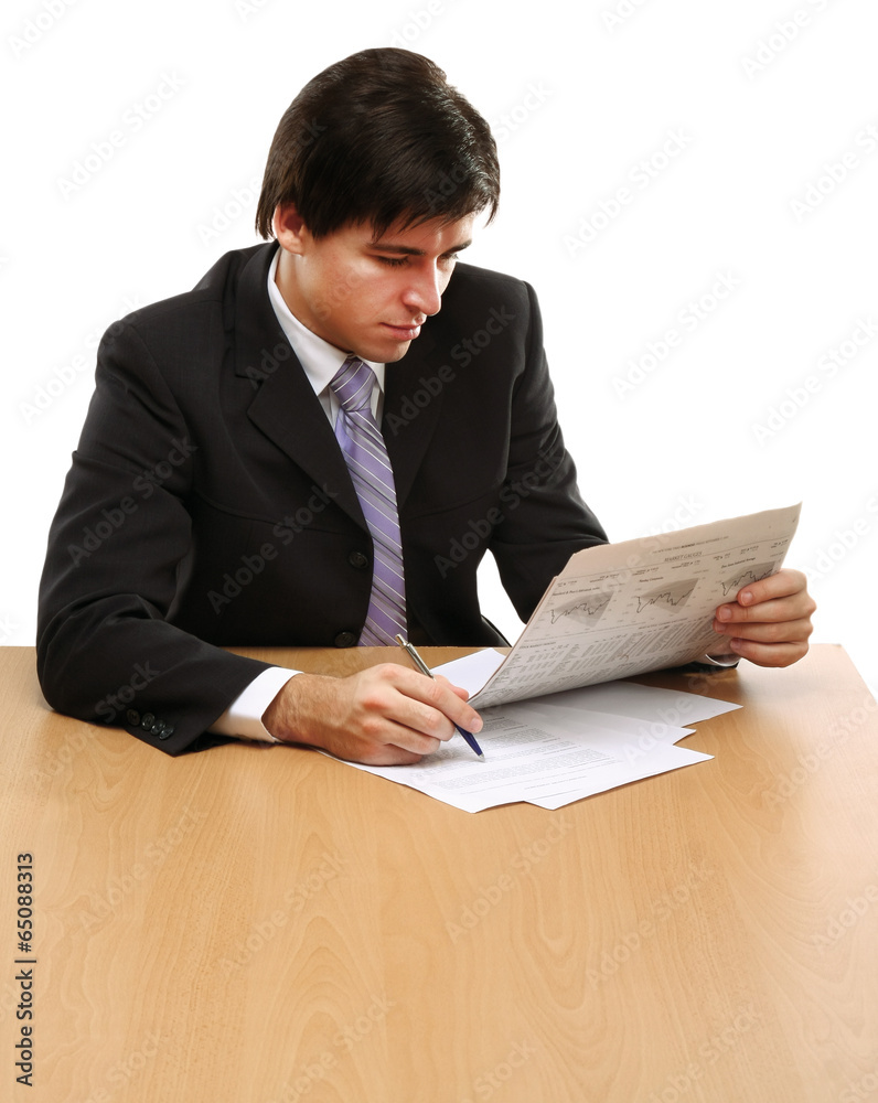Close-up portrait of a businessman reading newspaper Close-up portrait of a businessman reading newspaper