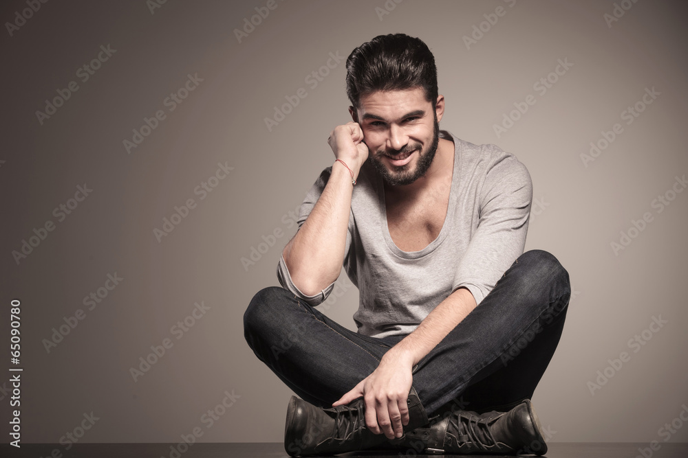 pensive young man with beard smiling pensive young man with beard smiling