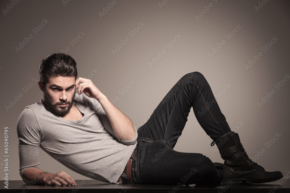 man lying down on the floor and thinking man lying down on the floor and thinking