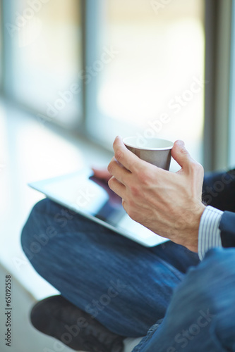 men with pc tablet and coffee