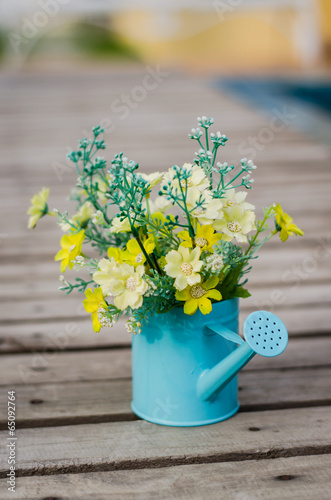 Fototapeta Naklejka Na Ścianę i Meble -  plastic flower in blue pot