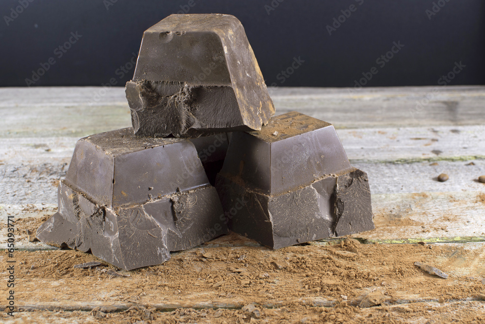 Three chocolate cubes on table