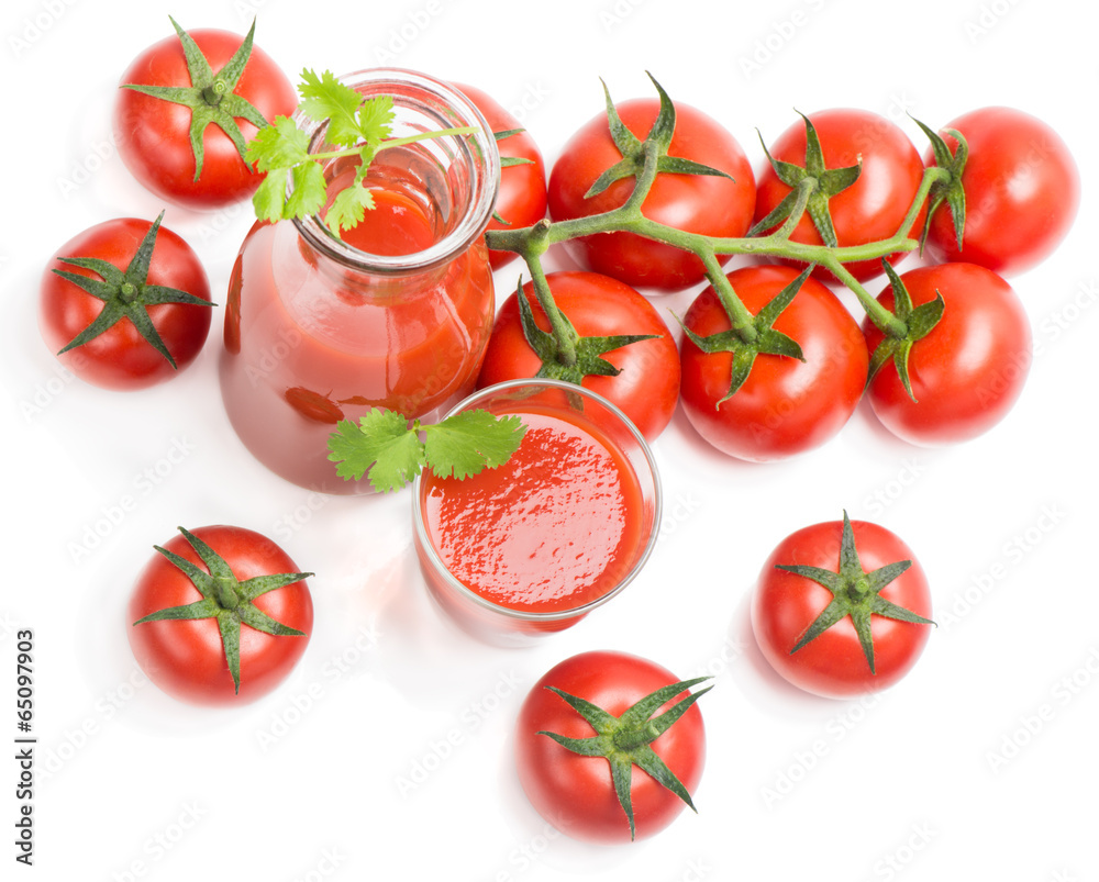 Bottle, glass of tomato juice and fruits with green leaves Bottle, glass of tomato juice and fruits with green leaves