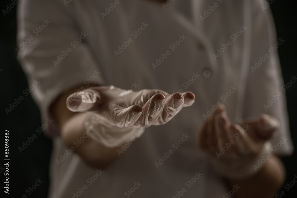 Female doctor holding something hands