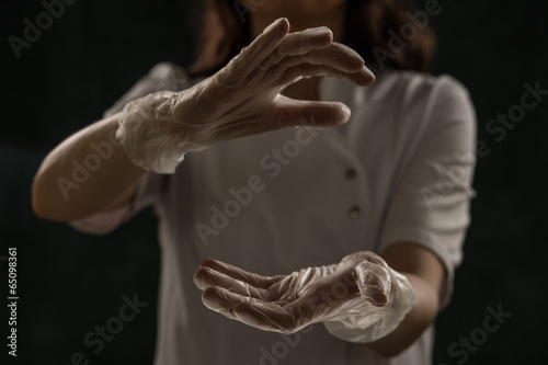 Female doctor holding something hands