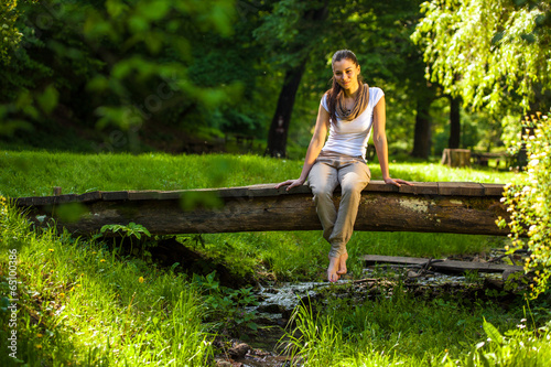 Young attractive woman relaxing  in park.