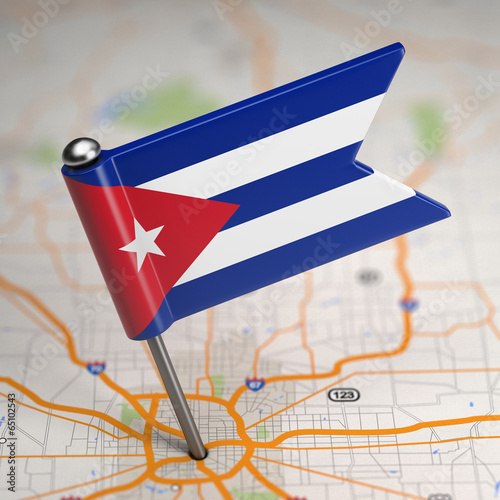 Photography Cuba Small Flag on a Map Background.