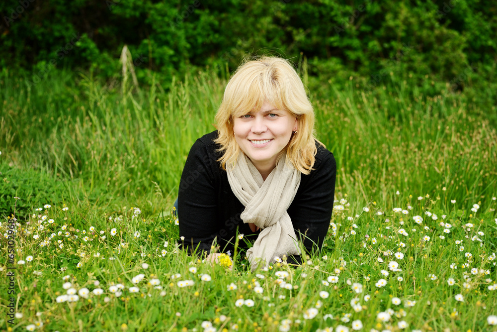 Fototapeta premium smiling middle aged woman outdoors
