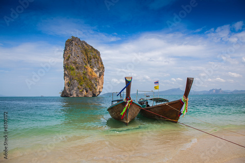 Tropical beach, traditional long tail boats