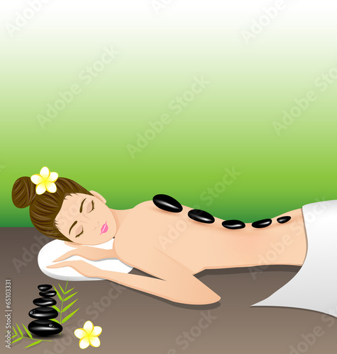 Beautiful woman lying a therapy with hot stones in spa