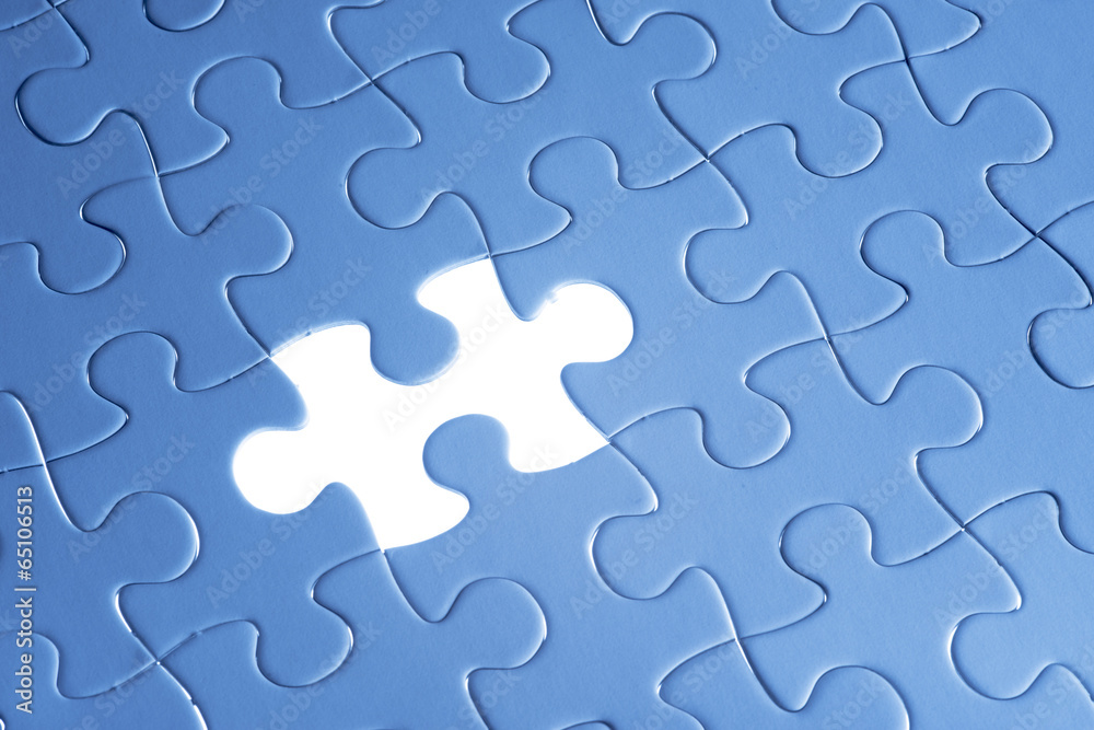 Missing jigsaw puzzle piece with light glow Missing jigsaw puzzle piece with light glow