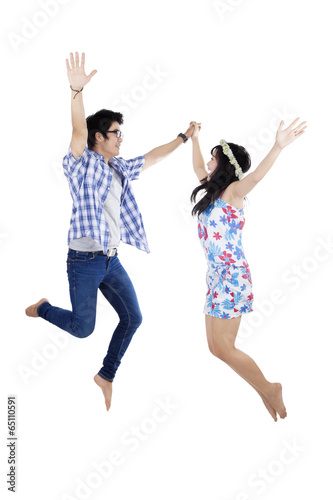 Young couple having fun isolated
