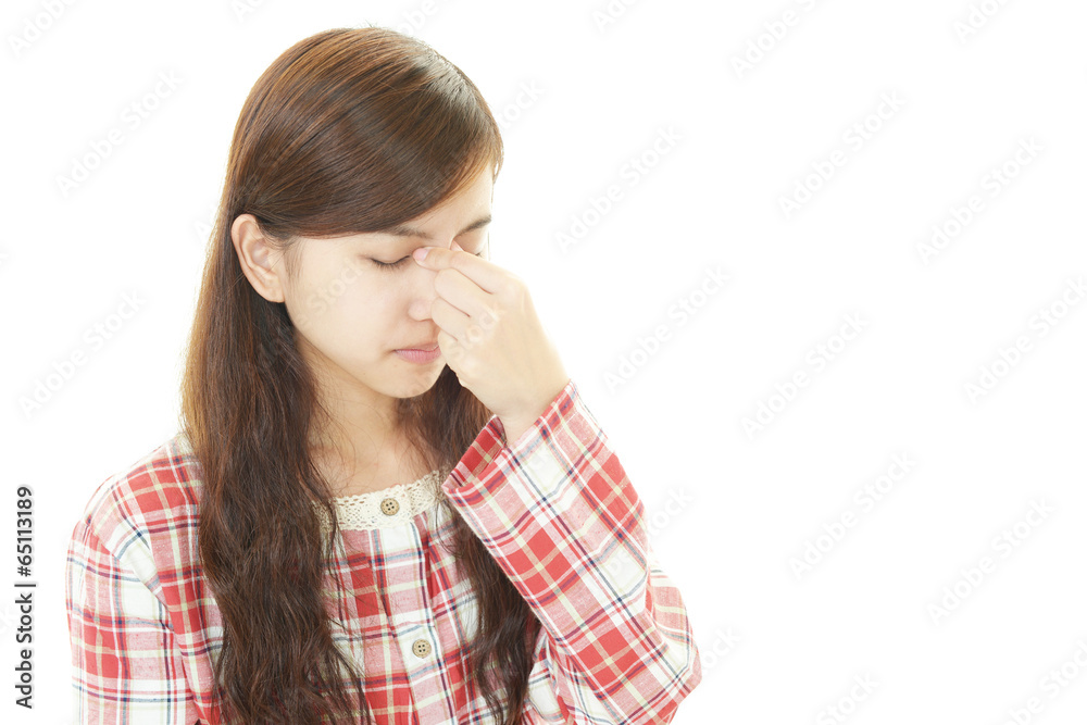 疲れた表情の女性