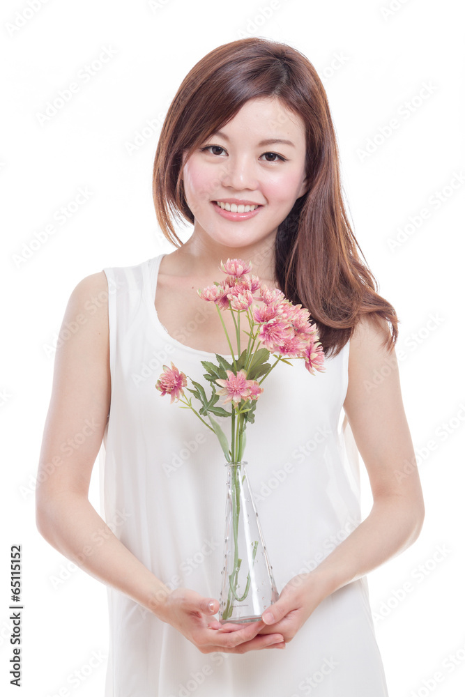 Asian woman holding flowers in a vase Asian woman holding flowers in a vase