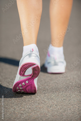 Walking in sports shoes. © gstockstudio