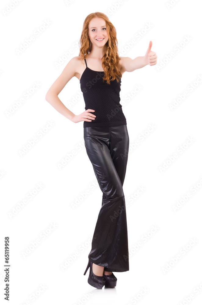 Redhead woman in black bell bottom pants on white Redhead woman in black bell bottom pants on white