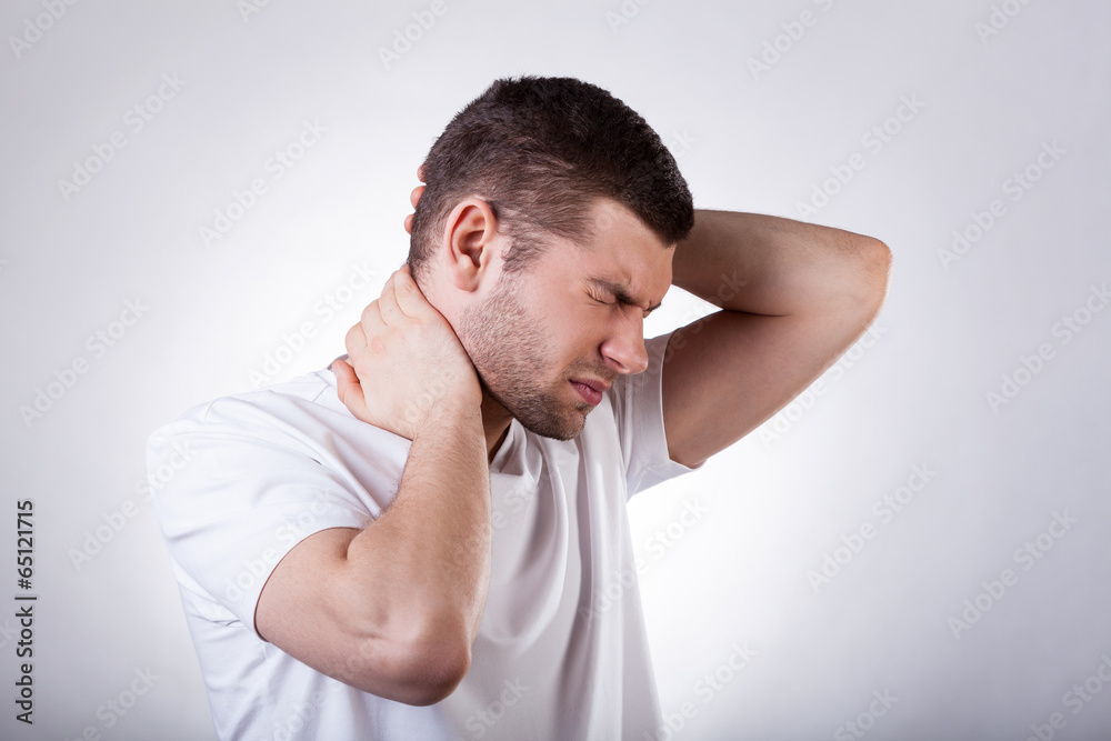 Man suffering from neck pain Man suffering from neck pain