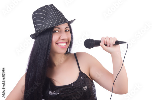 Young female singer with mic on white