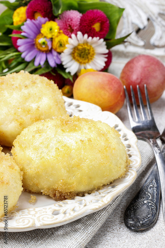 Peach in pastry, popular austrian dish. Garden party table