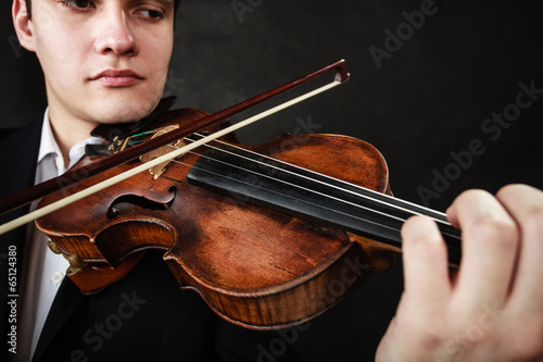 Man violinist playing violin. Classical music art