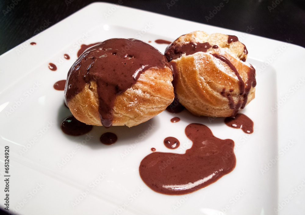 Sweet buns served with chocolate sauce Sweet buns served with chocolate sauce