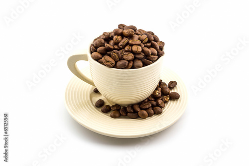 Brown roasted coffee beans in coffee cup