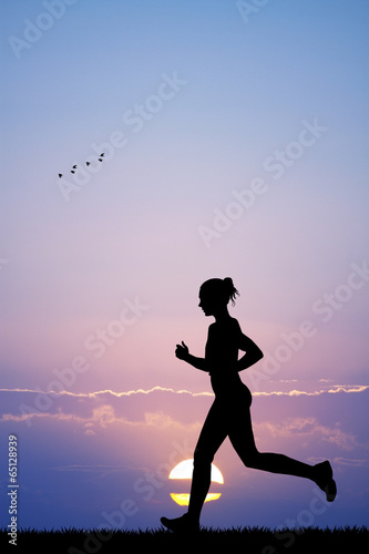 Girl running at sunset