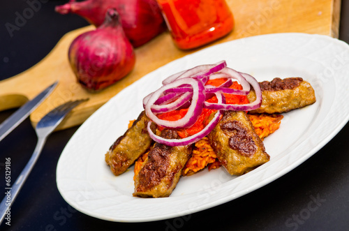 Cevapi with rice, ajwar and onion photo