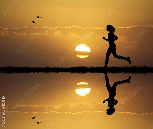 Girl running at sunset