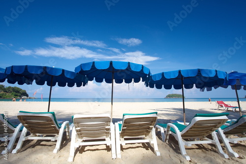 Chairs and umbrella on a beautiful tropical beach