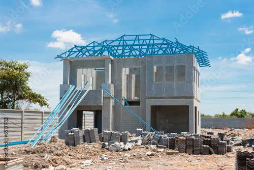 New home under construction using steel frames against cloudy sk