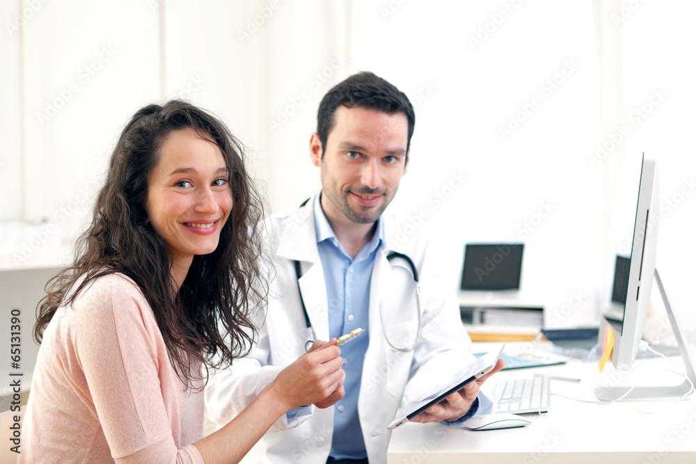 Doctor using tablet to inform patient Doctor using tablet to inform patient