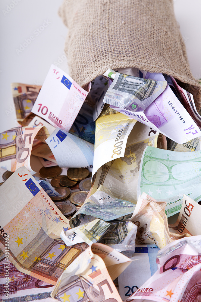 Money bag with euro notes and coins Stock Photo | Adobe Stock