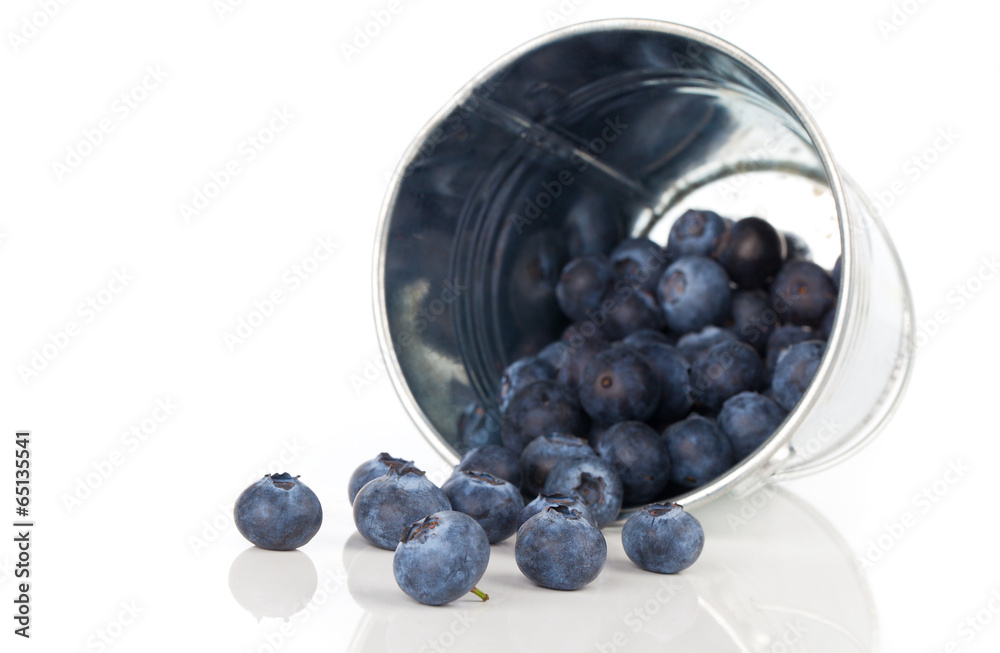 blueberry berries in a metal bucket, isolated on white backgroun blueberry berries in a metal bucket, isolated on white backgroun