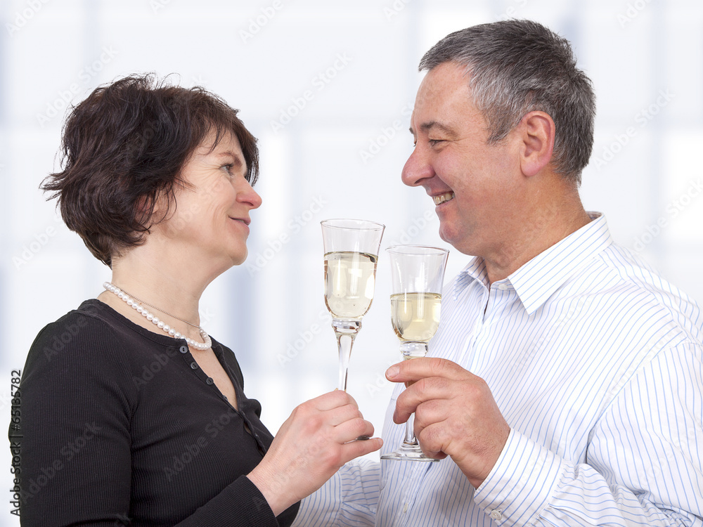 Man and woman celebrating with champagne Man and woman celebrating with champagne