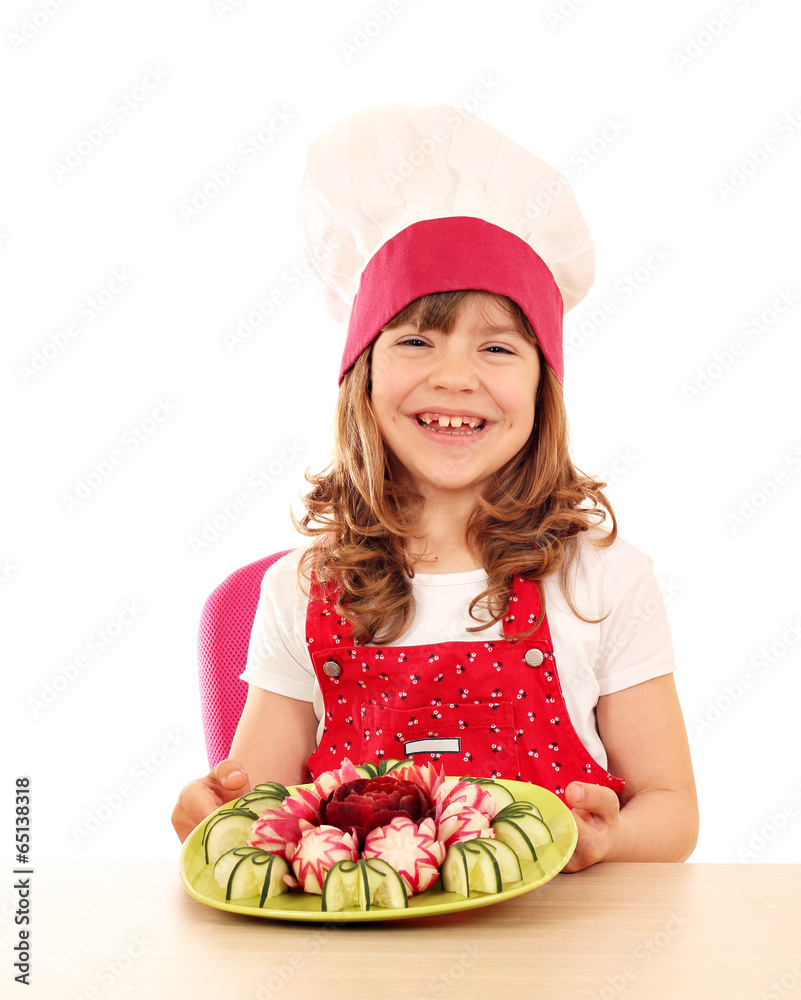 happy little girl cook with decorated salad