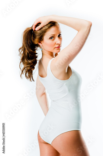 young and beautiful woman in white swimsuit
