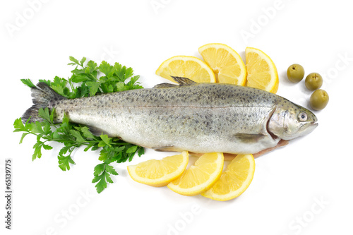 Fresh trout with parsley, lemon and olives isolated on white