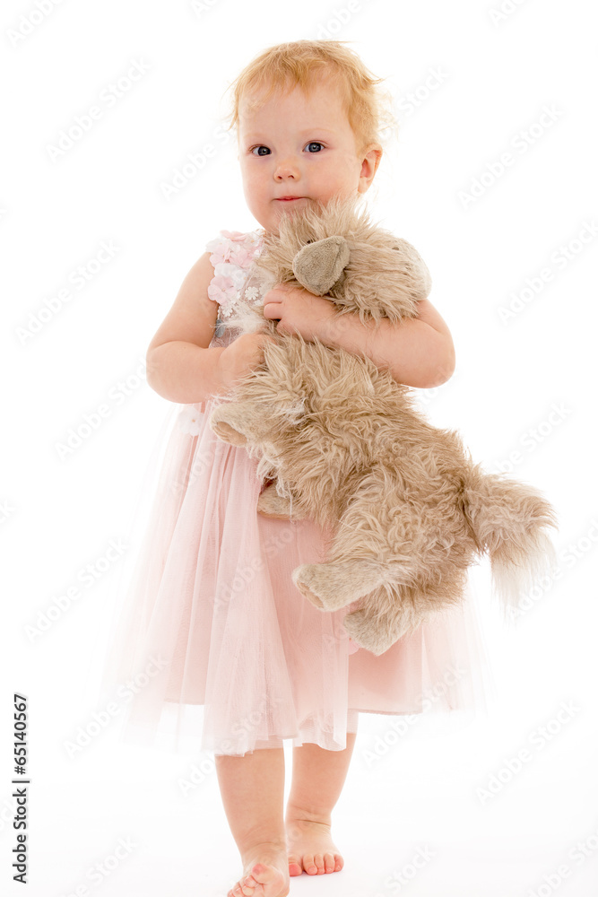 pretty little girl with a toy dog. pretty little girl with a toy dog.