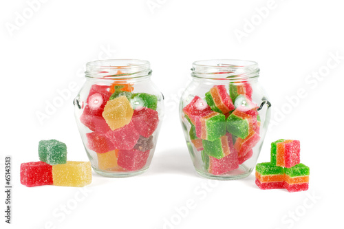 Glass jars filled with different colorful jelly