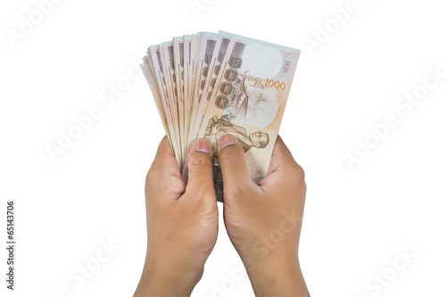 Hand holding thai money isolated