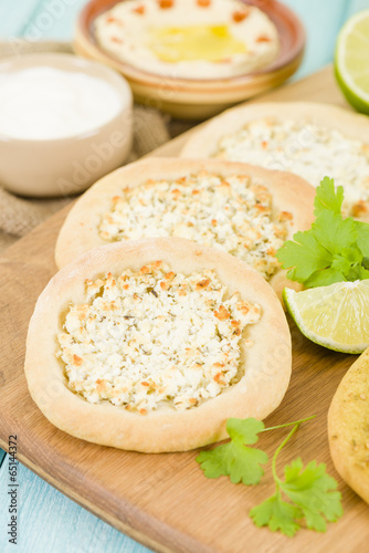 Cheese Manakish - Arabic flatbread tooped with cheese. photo