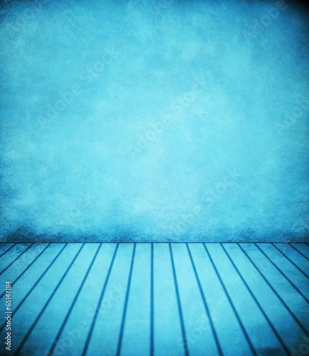 abstract blue background or dark paper with bright center spotli