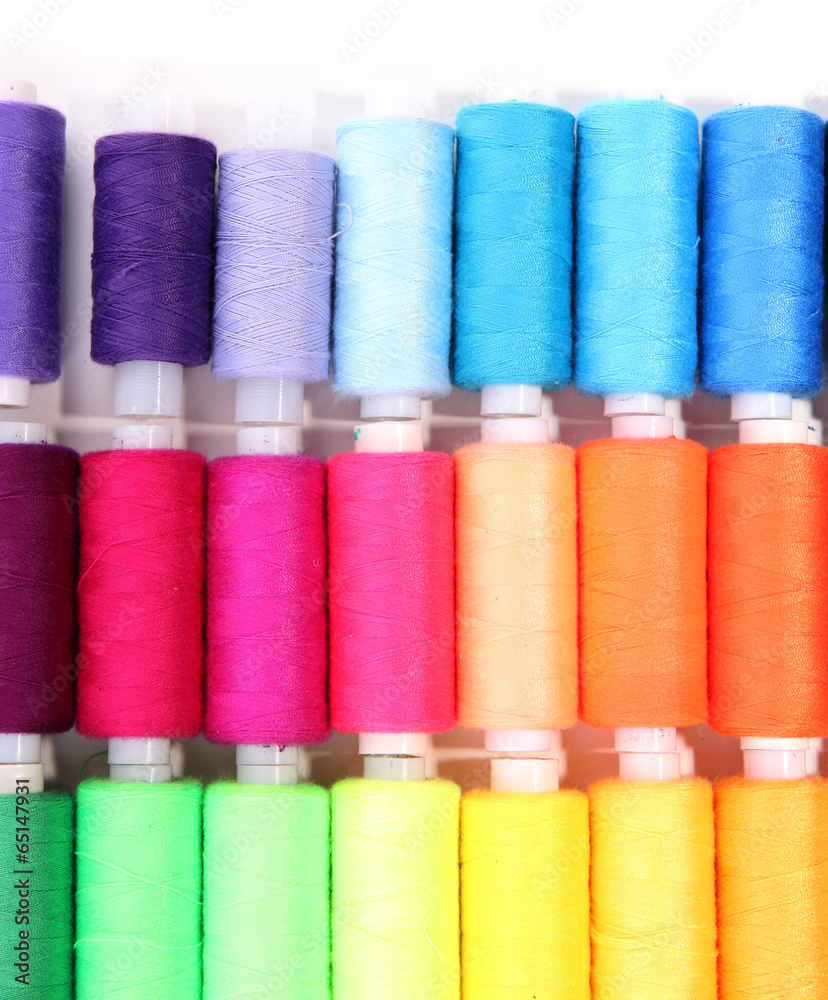 Multicolor sewing threads isolated on white Multicolor sewing threads isolated on white