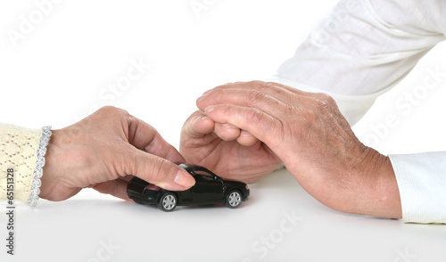 Hands with miniature car