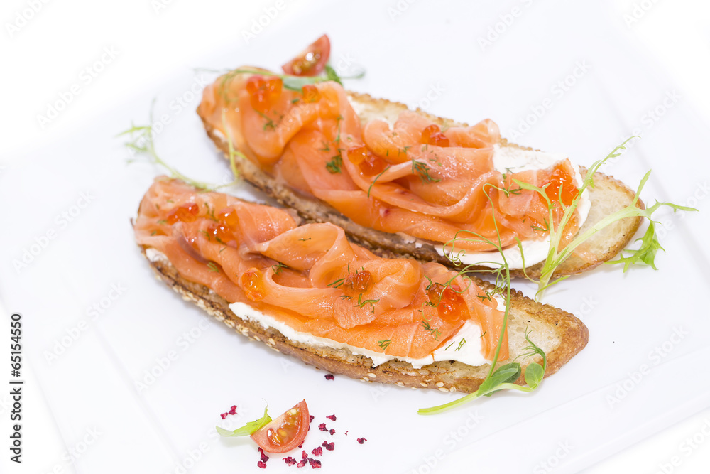 sandwiches with salmon caviar and greens adorned